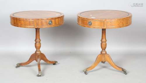 A pair of modern reproduction hardwood drum-top occasional t...