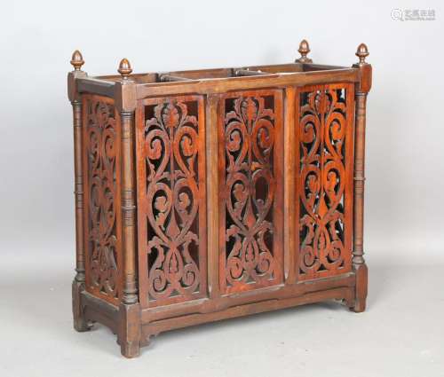 A late Victorian walnut three-division stick stand with pier...