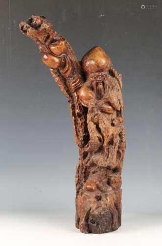 A mid-20th century Chinese carved hardwood figure of Shoulao