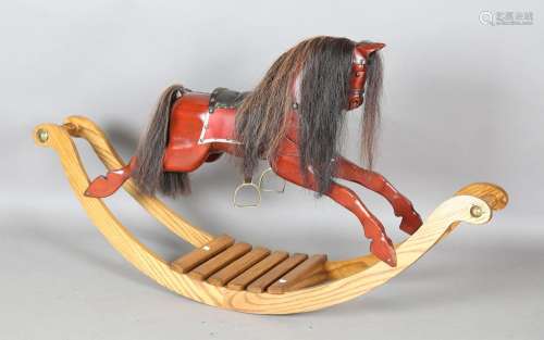 A modern carved wooden rocking horse