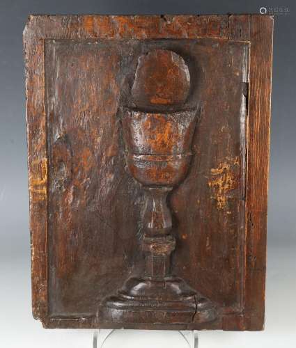 A 17th century walnut ecclesiastical panel