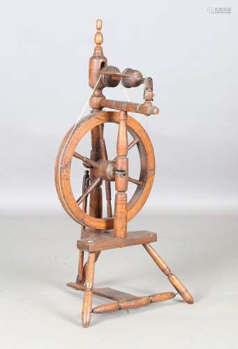 A 19th century softwood spinning wheel