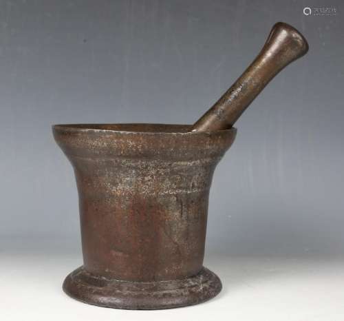 A large 18th century cast iron pestle and mortar