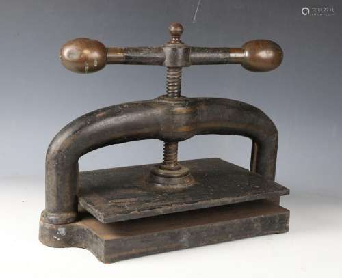 A late 19th/early 20th century cast iron bookpress with larg...