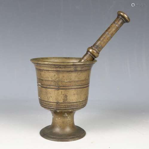 A 19th century patinated bronze pestle and mortar of turned ...
