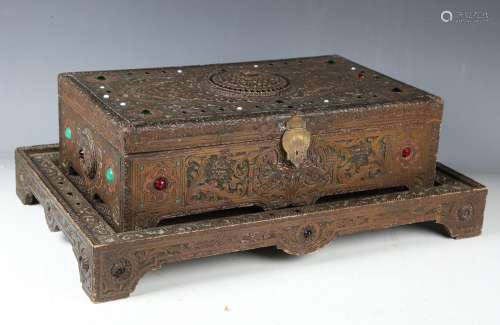 An early 20th century Romanian carved softwood box and stand