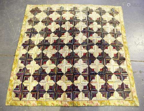 An early 20th century patchwork quilt