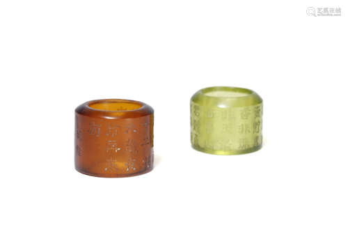 A Pair Of Glass Thumb Rings