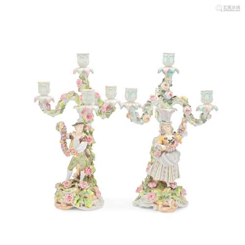 A PAIR OF SCHIERHOLZ FLORAL ENCRUSTED PORCELAIN THREE-BRANCH...