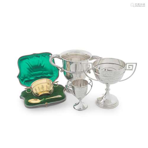 THREE TWO-HANDLED PRESENTATION CUPS The largest by Walker an...