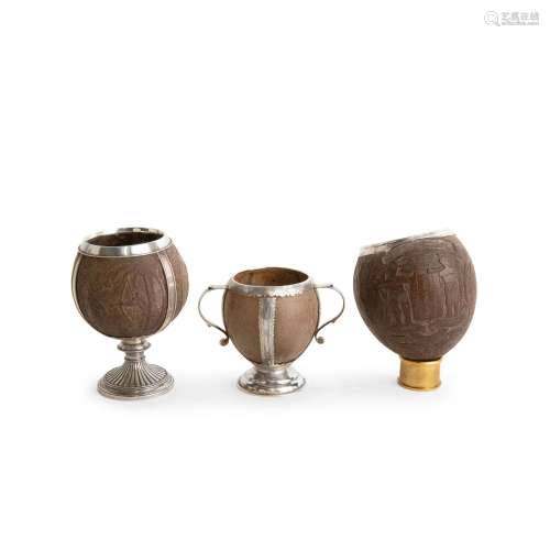 THREE SILVER-MOUNTED COCONUT CUPS The first by John Stoyte, ...