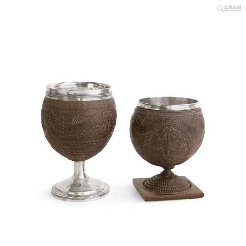 TWO GEORGE III SILVER MOUNTED CARVED COCONUT CUPS The first ...