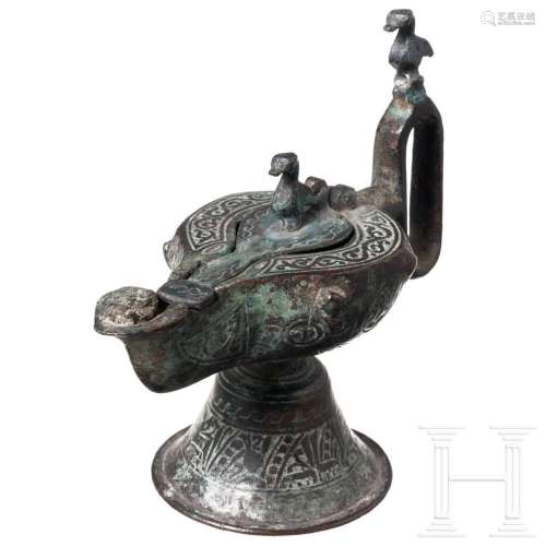 An Ottoman oil lamp, bronze, 12th century