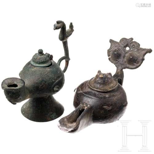 Two bronze islamic oil lamps, 11th/12th century