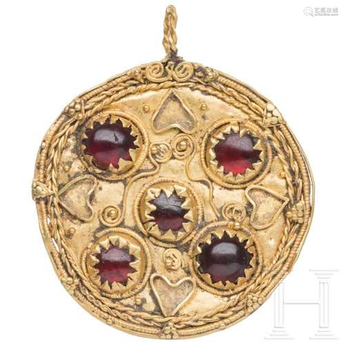 A Greek gold medallion with five garnet cabochons, mid-4th c...