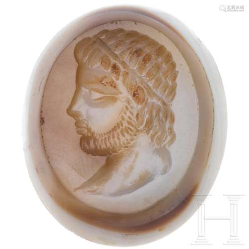 A Hellenistic intaglio with the head of a bearded man with a...