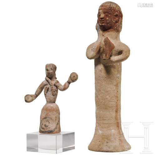 A Cypriote statuette of a woman with a tympanon and a Boeoti...