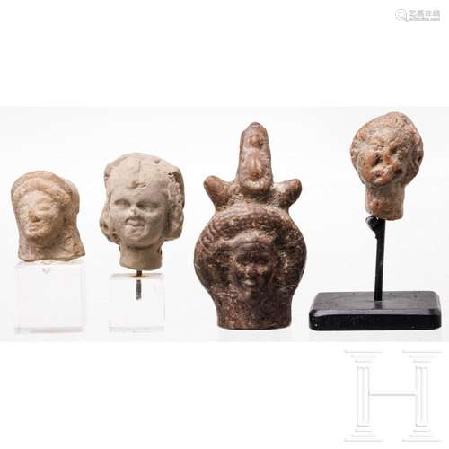 Four Hellenistic ceramic and terracotta heads, 3rd- first ce...