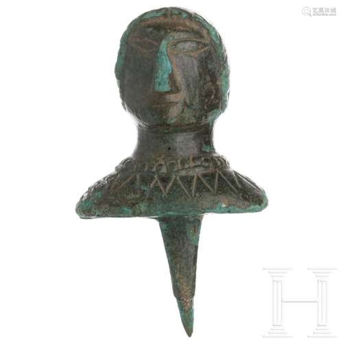 A Roman furniture fitting in the shape of a head, bronze, 1s...