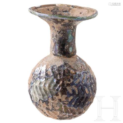 A mouth-blown glass sprinkler, Roman Levant, 3rd century A.D...