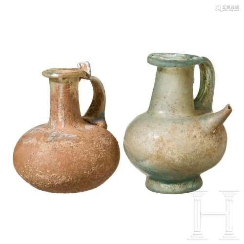 Two Roman glass jugs, 2nd century A.D.