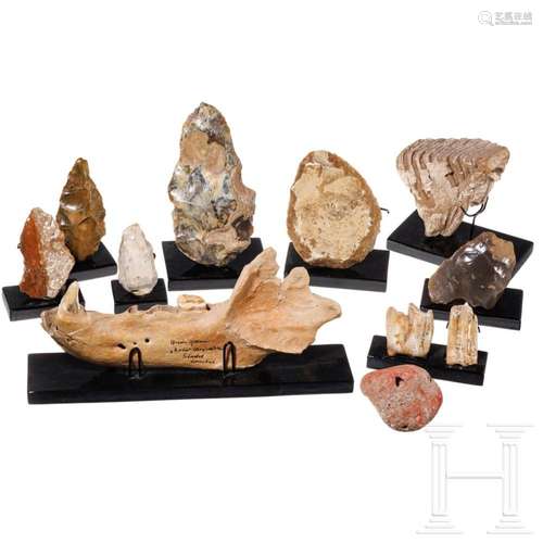 Six palaeolithic flint tools, a ruddle stone and four palaeo...