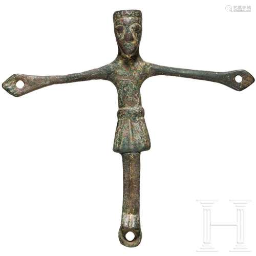 A bronze figure of Christ from a small Romanesque crucifix, ...