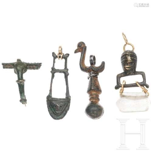 Four pieces of ancient bronze artefacts, made wearable with ...