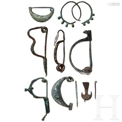 Seven ancient bronze fibulae and an early medieval pair of b...