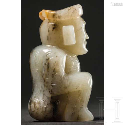 A carved Chinese jade figure of a crouching man with horns, ...