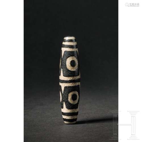 A six-eyed dzi bead, 20th century