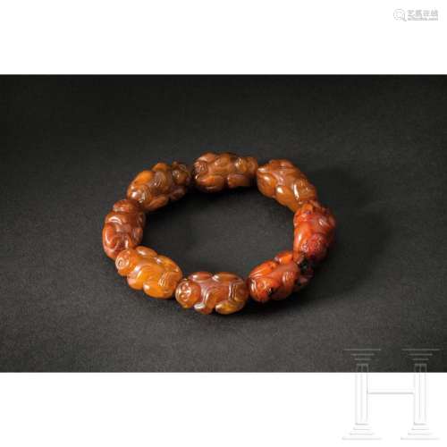 A Chinese jade bracelet with apes, 20th century
