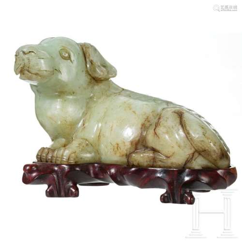 A Chinese jade figure of a reclining dog, 20th century