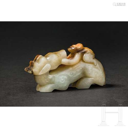 A carved Chinese jade figure of a boy and a deer, 20th centu...