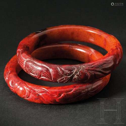 A pair of finely carved Chinese jadeit bangles, 20th century