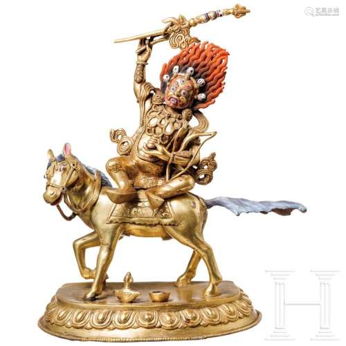A Tibetan bronze figure of Mahakala riding a mule, circa 190...
