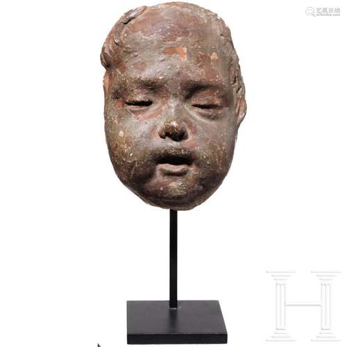 A terracotta death mask of an infant, 18th/19th century