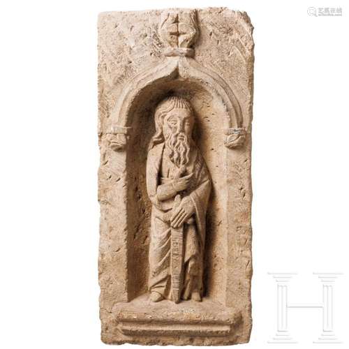 A late medieval cast stone relief with a saint (St. Paul), p...