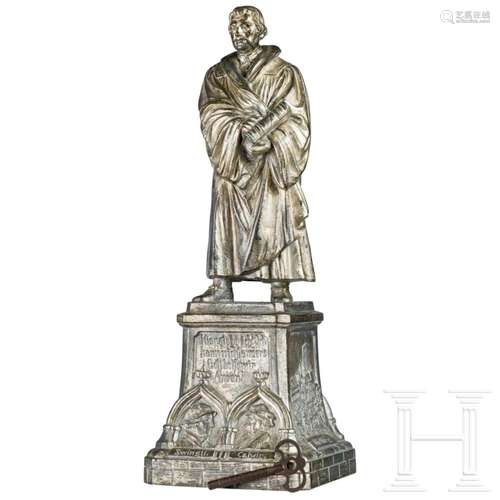 A German statue of Martin Luther with a music box, late 19th...