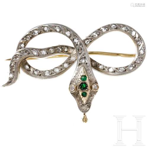 A snake-shaped brooch set with diamonds