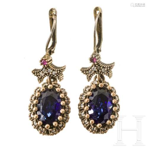 A pair of earrings with spinel