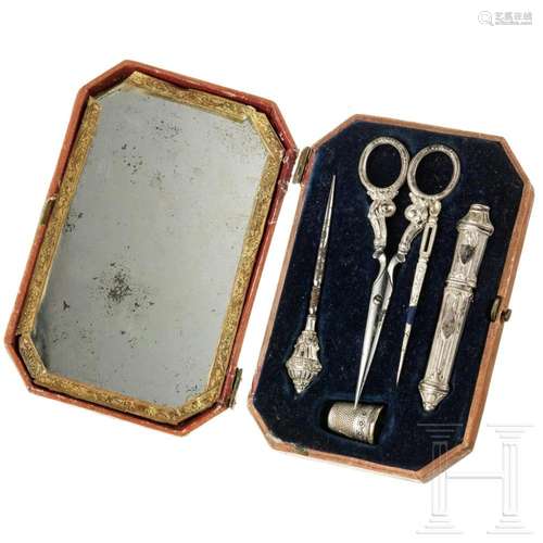 A partial-silver sewing kit with depiction of a hunter, 19th...