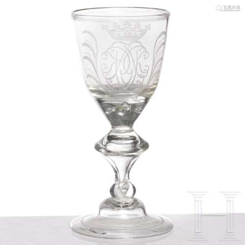 A glass goblet with crowned mirror monogram, circa 1710