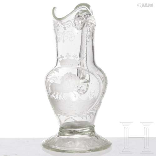 A North Bohemian colourless glass decanter with engraved hor...