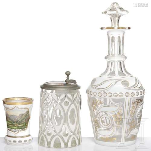 A Bohemian decanter with stopper, a beaker and a pewter-moun...