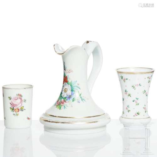 A Bohemian milk glass jug and two beakers, early 19th centur...