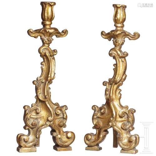 A pair of southern German gilt wooden candlesticks, mid-18th...