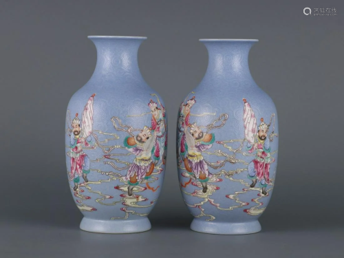A Pair of Blue Ground Famille-rose Vases