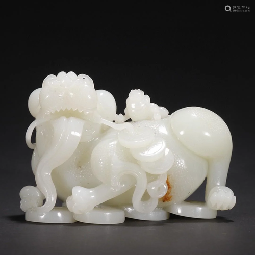 A Very Finely Carved White Jade Lion Ornament