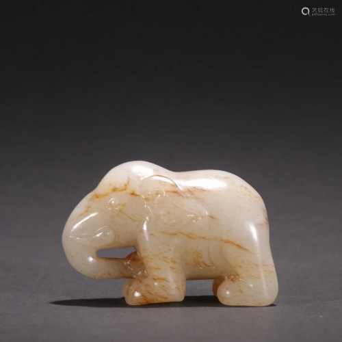 A Top and Finely Carved White Jade Elephant Ornament